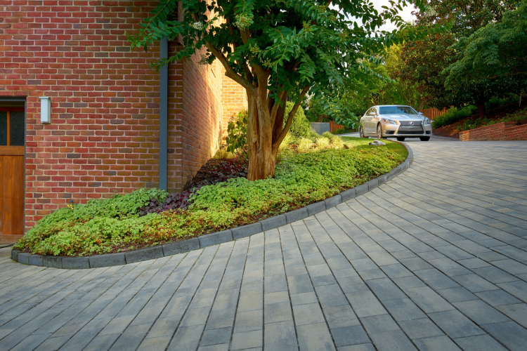 Custom masonry work in Alexandria, showcasing an intricate stone driveway