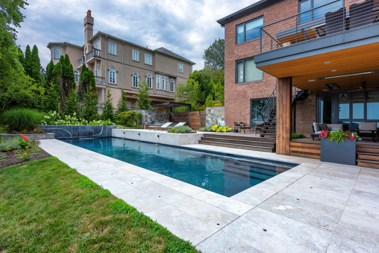 Beautifully landscaped backyard in Alexandria, with a refreshing pool as the centerpiece.