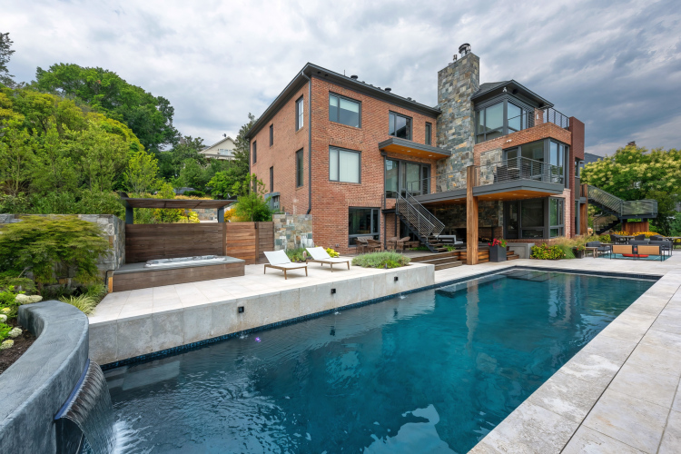 Another view of the landscaped backyard in Alexandria, with a pool as the centerpiece.