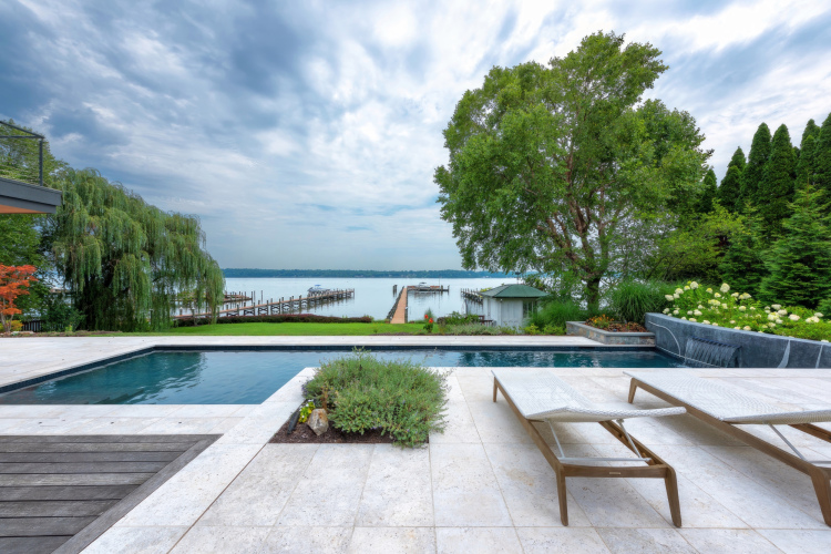 Outdoor seating area overlooking the pool and ocean