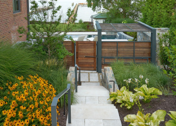 Stone pathway in Alexandria, meandering through a well-maintained garden.