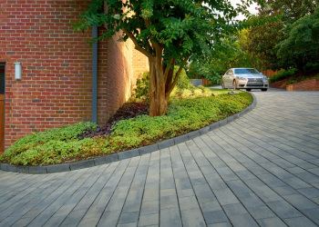 Custom masonry work in Alexandria, showcasing an intricate stone driveway