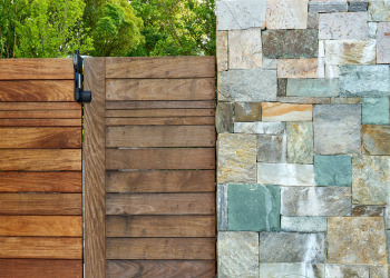 Close up of gate and stone fencing