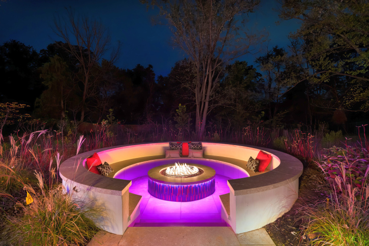 Captivating fire pit surrounded by comfortable seating, perfect for cozy evenings under the stars.