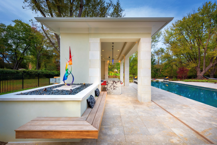 Sculptural accents and artistic touches adding visual interest and sophistication to the poolside ambiance.