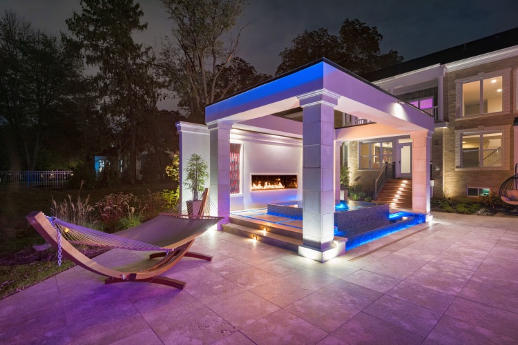 Pergola at night with landscape lights in McLean
