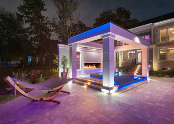 Pergola at night with landscape lights in McLean