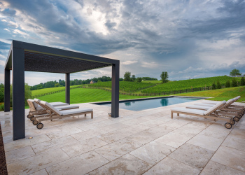 Modern Farmhouse Backyard Patio Design with Seating and Custom Pool Design