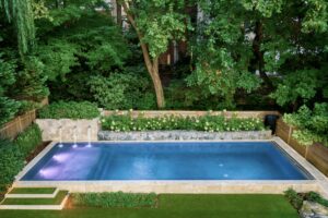 Pool with Flowers Surrounding by a Pool Deck Builder in Leesburg, VA