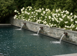 Waterfall features into custom pool in Sterling, VA