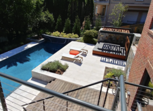 Overlooking custom pool deck from outdoor living company Potomac, MD