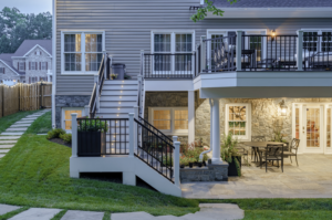 Under custom deck built in Arlington, VA including stairs with outdoor lighting