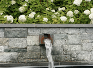 Close up of water feature and flowers