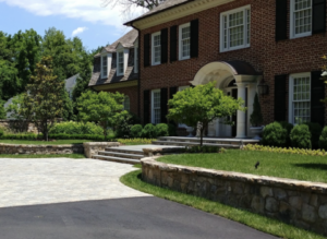 Front door exterior of luxury home with yard maintenance in Potomac, MD