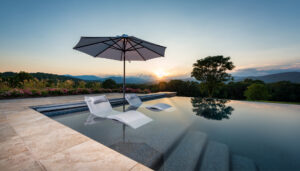 Sunset poolside after landscape design and custom pool design in Sterling, VA