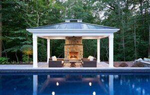 Pavilion by pool and woods after outdoor design in Aldie, VA