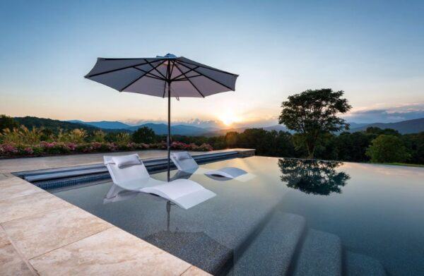 pool and patio oasis designed by a pool builder in Reston, VA